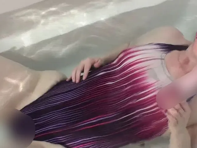 Violett swimsuit meets pink vibrator underwater in bathtube orgasm