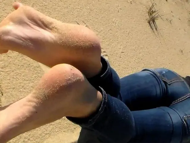 Schöne Füße im Strand Sand