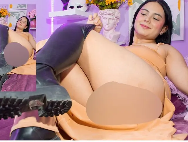 Lucy touches her pussy with leather boots