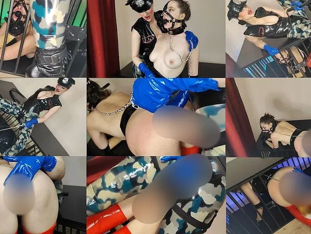 Latex-Offizier fickt seinen Latex-Gefangenen mit einem Strap-on